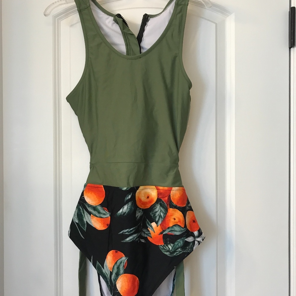 One piece solid top peach print bottom swimsuit